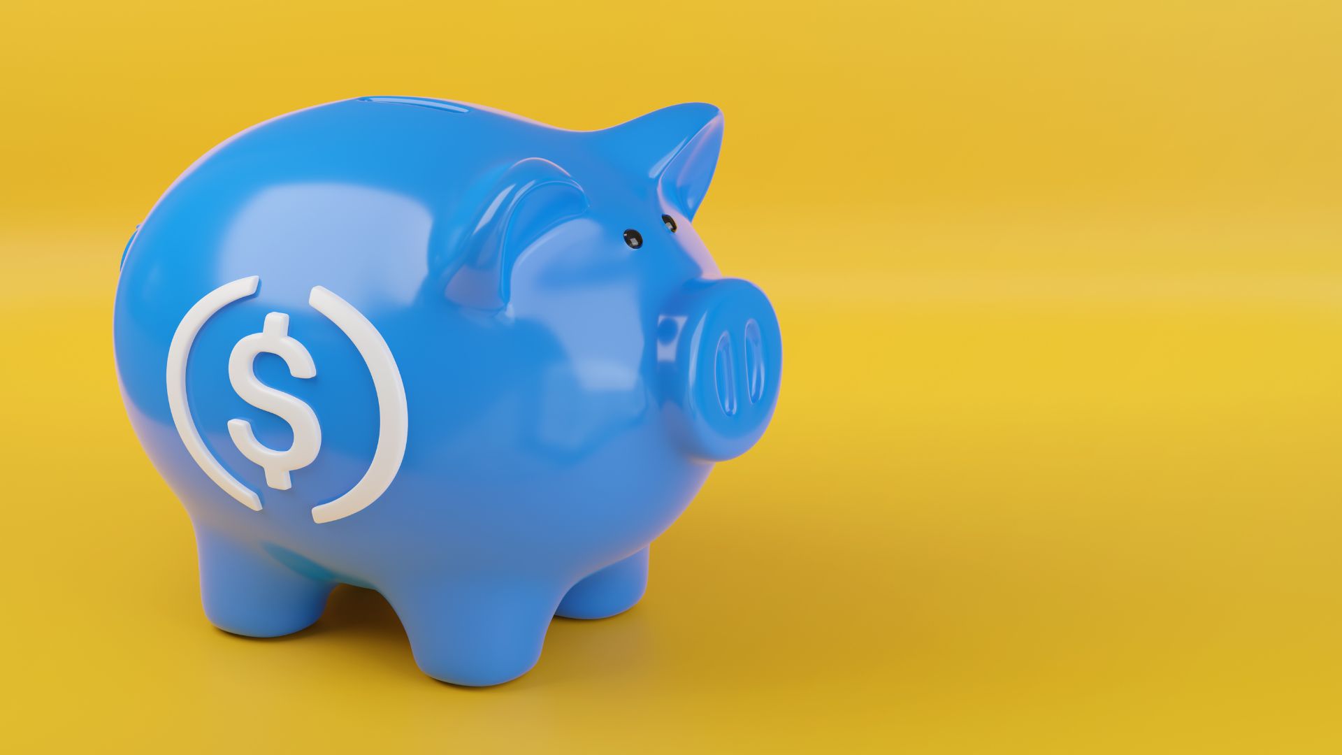 Blue piggy bank with a USDC coin logo on its side, against a yellow background.